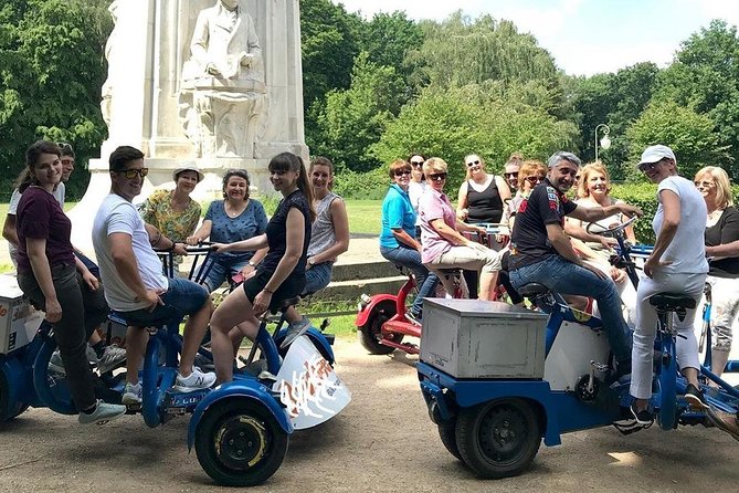 Beer Bike & Party Bike Highlights Berlin City Tour including pick-up - Potsdamer Platz stories: traffic light, wall remnants, and a panorama point