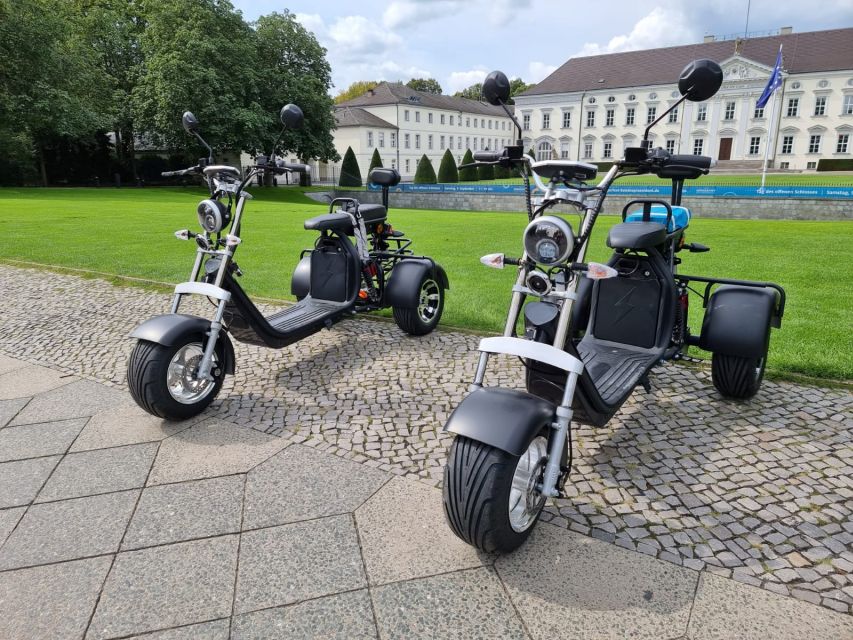 Berlin City: 2 Hour Guided Fat Tire E-Scooter Tour - Checkpoint Charlie: the Wall-era crossing point people picture instantly
