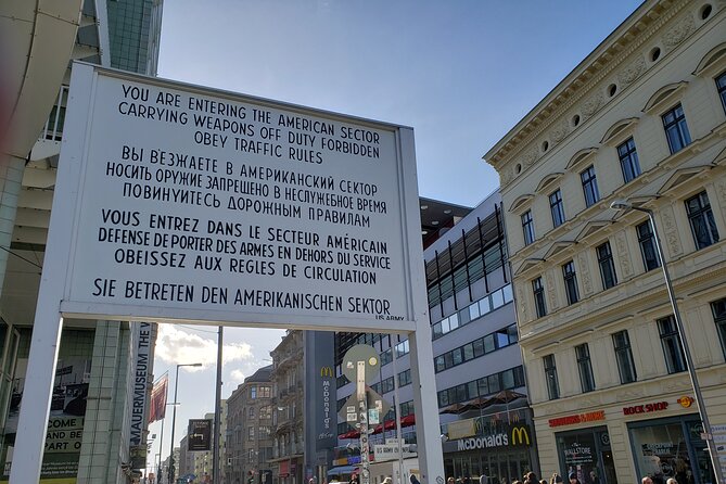 Berlin: Private Highlights Walking Tour with Local Guide and Hotel pickup - Checkpoint Charlie: understanding the border as a mindset
