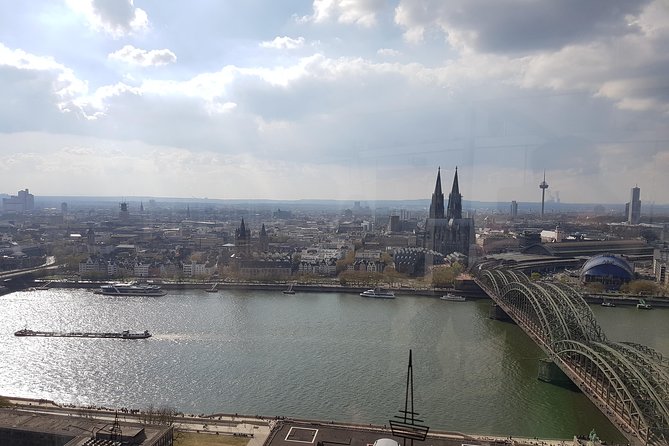 Cologne City Tour Experience cathedral city on the Rhine - Gross St. Martin, Tunnes and Schal, Willi Ostermann, and the market-and-fountain storytelling