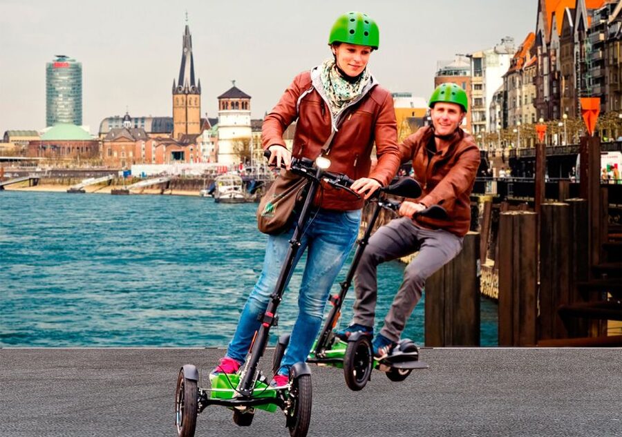 Düsseldorf: E-Scooter City Tour - Burgplatz and the castle-tower vibe you can feel in motion