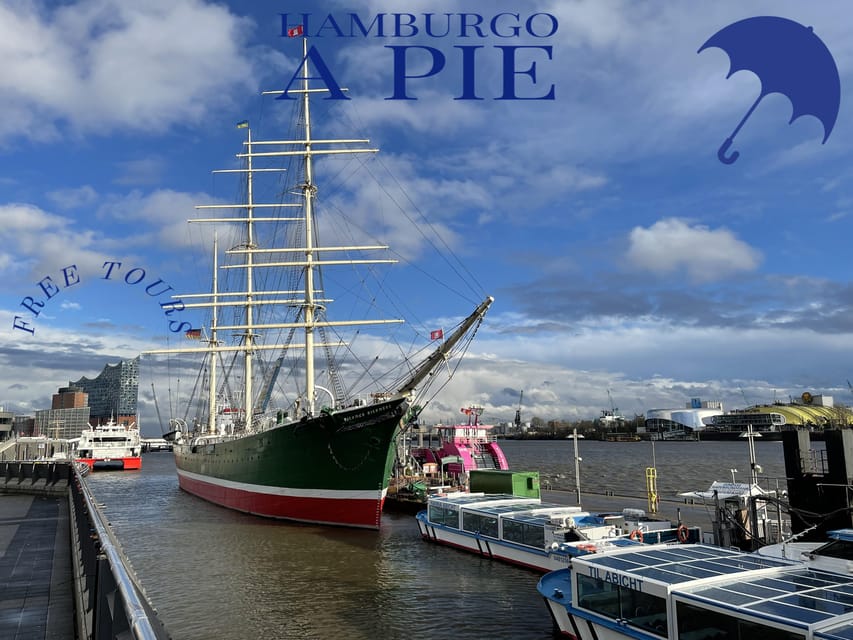 Free Tour: Port, Red Light District and Beatles. You decide how much to pay at the end - How the Route Works on the Ground, Start, Finish, and a Blue Umbrella