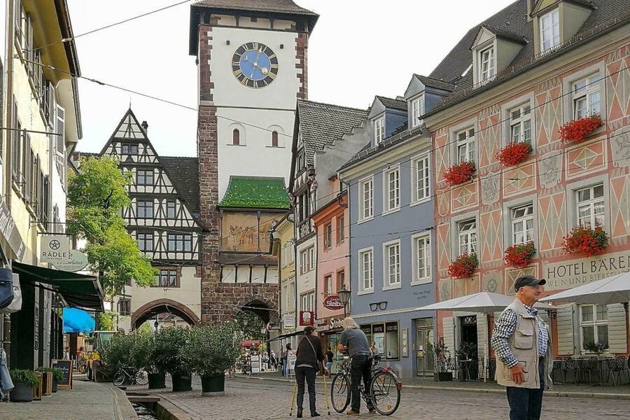 Freiburg: Gässle, Bächle and More City Tour - Martins gate and Rathausplatz: two town halls in one stop
