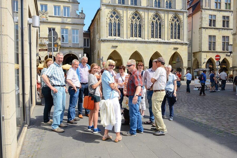 Münster: Old Town Highlights Guided Tour - Prinzipalmarkt and Lamberti Church, where the guide ties landmarks to events