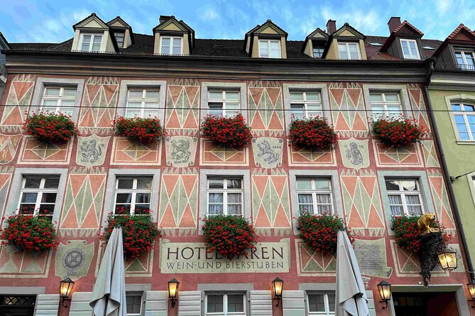 Self Guided Walking Tour through Old Town Freiburg - Stained glass calm and Renaissance humanism at Haus zum Walfisch